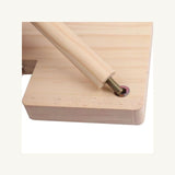 Close view of the wooden screw-in leg and fitted metal insert