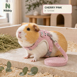 Cherry Blossom Pink Nibbly small-pet vest harness and lead worn by a relaxed guinea pig