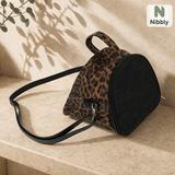 Leopard-texture Nibbly GliderPod Carrier with black mesh front and shoulder strap