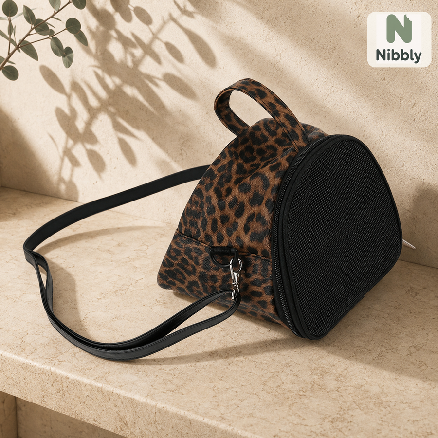 Leopard-texture Nibbly GliderPod Carrier with black mesh front and shoulder strap