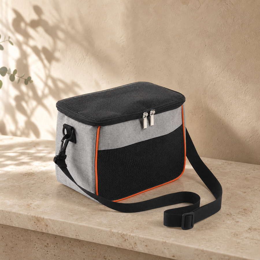 Gray Nibbly Nestaway Carrier with black mesh panels and adjustable strap